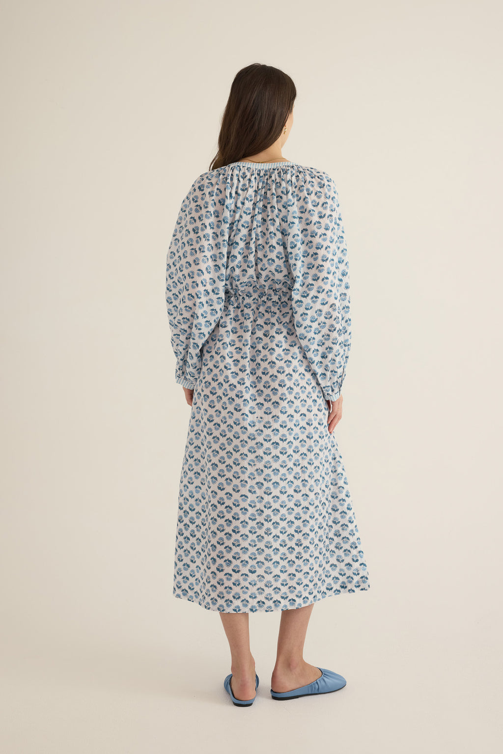 Back view of model wearing the Juliet Block Printed Cotton Drop Sleeve Raglan Shirt Dress in Blue Gardenia