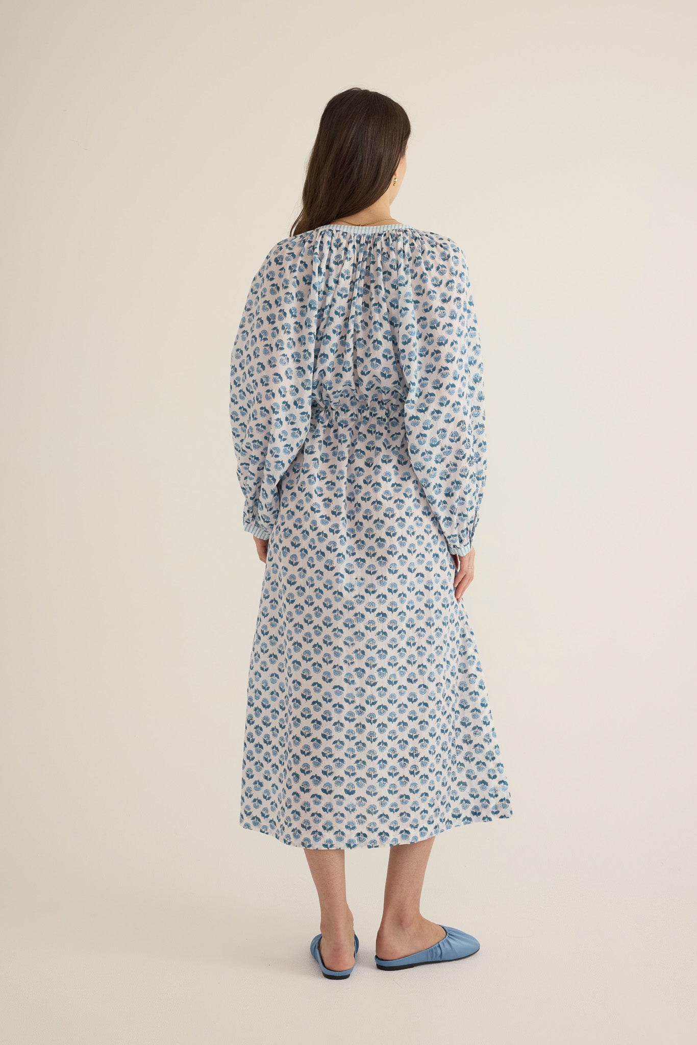 Back view of model wearing the Juliet Block Printed Cotton Drop Sleeve Raglan Shirt Dress in Blue Gardenia