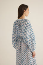 Side closeup view of model wearing the Juliet Block Printed Cotton Drop Sleeve Raglan Shirt Dress in Blue Gardenia, showing the billowing sleeve and gathered detail