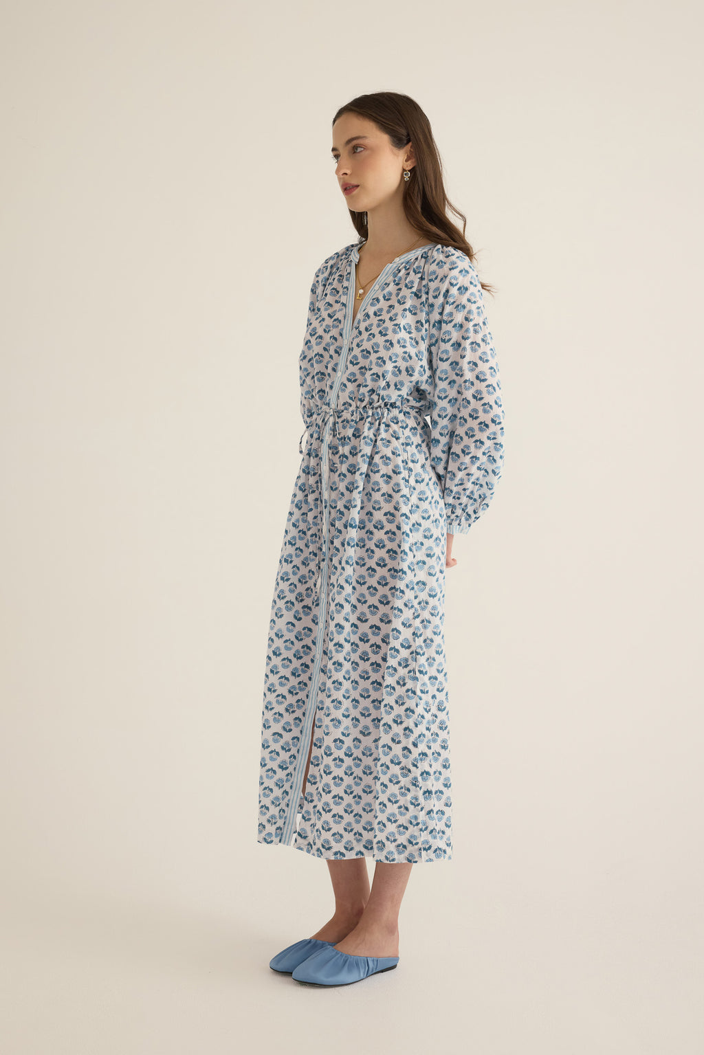 Side view of model wearing the Juliet Block Printed Cotton Drop Sleeve Raglan Shirt Dress in Blue Gardenia