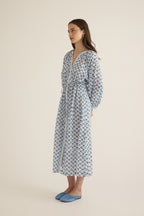 Side view of model wearing the Juliet Block Printed Cotton Drop Sleeve Raglan Shirt Dress in Blue Gardenia
