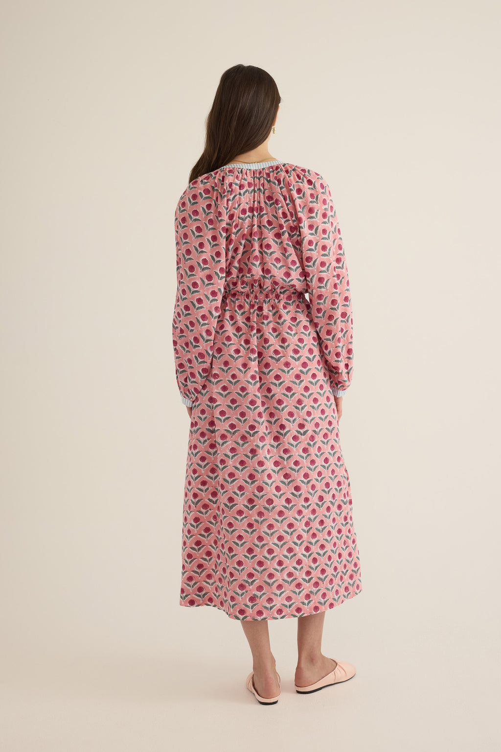 Back view of model wearing the Juliet Block Printed Cotton Drop Sleeve Raglan Shirt Dress in Pink Dahlia