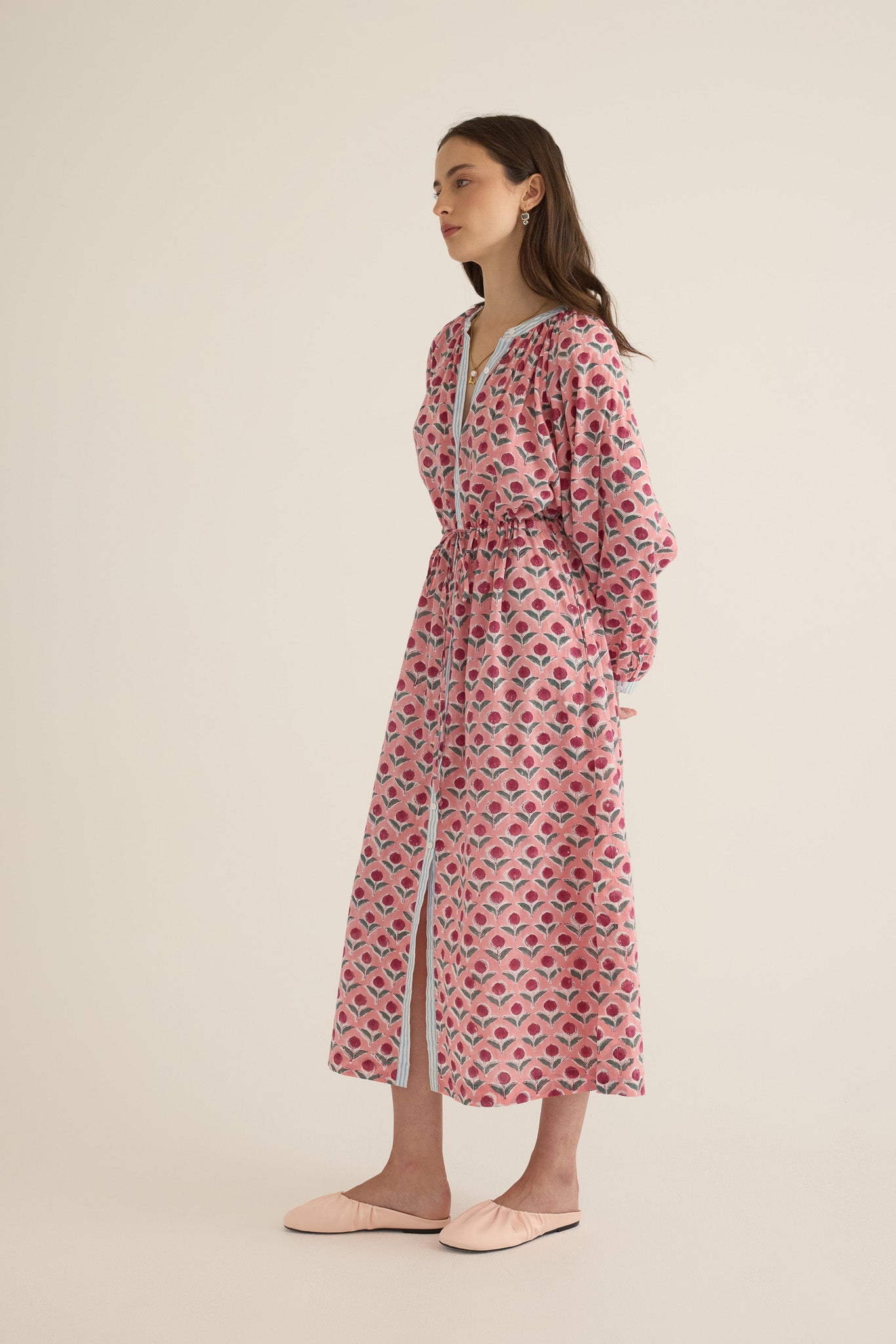 Side view of model wearing the Juliet Block Printed Cotton Drop Sleeve Raglan Shirt Dress in Pink Dahlia