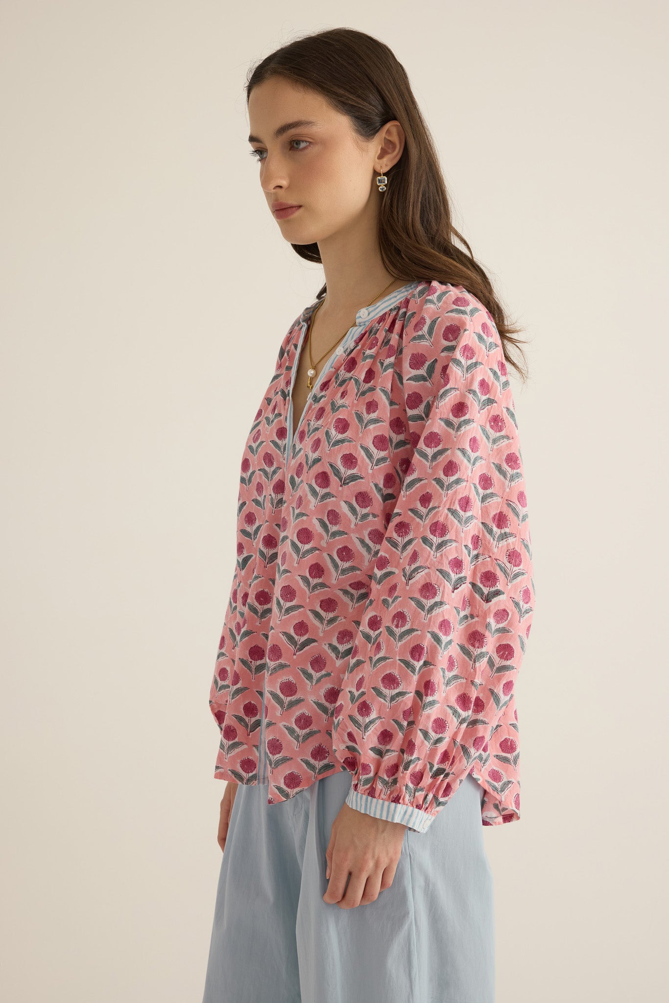Side view of model wearing the Juliet Block Printed Cotton Drop Sleeve Raglan Shirt in Pink Dahlia