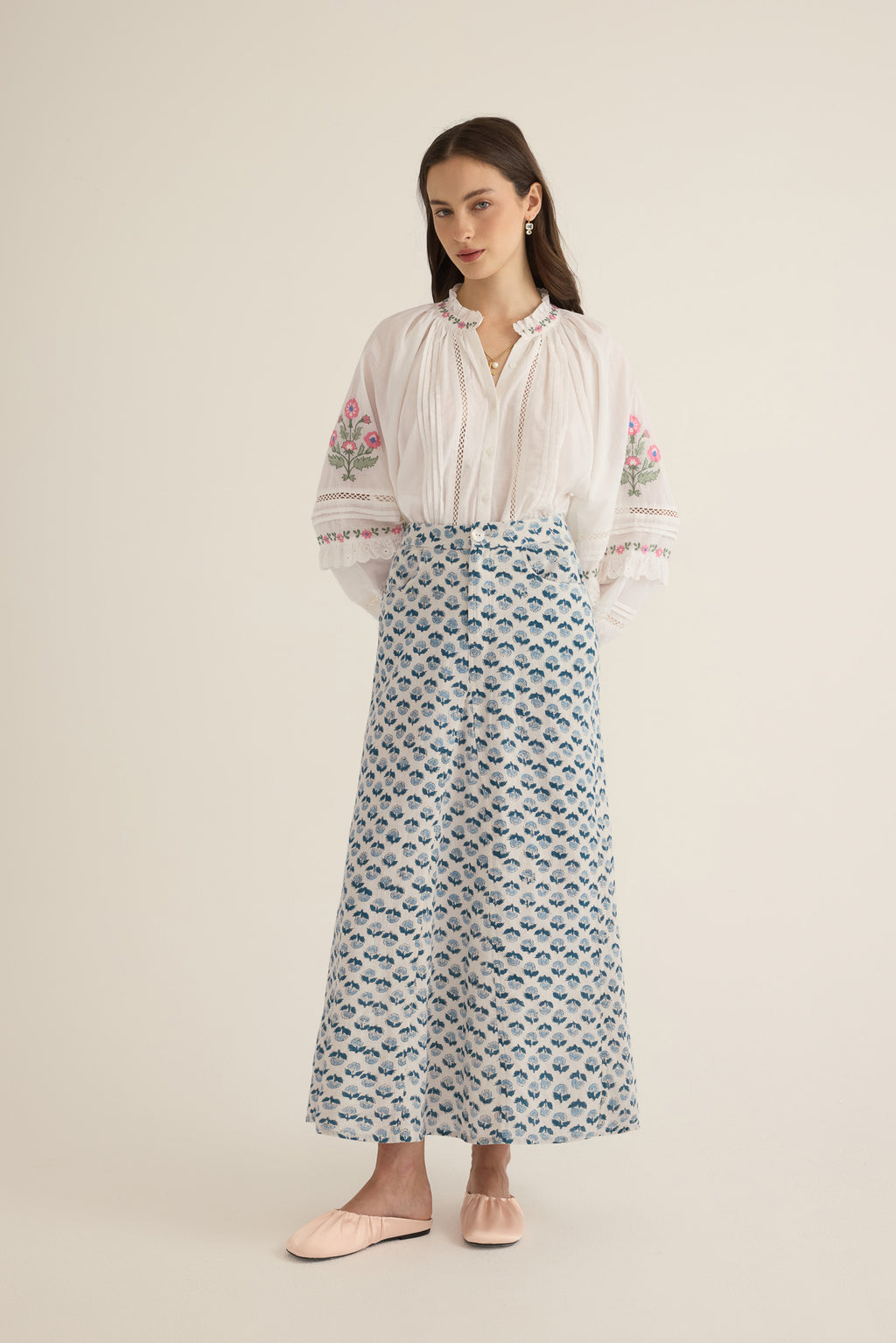 Front view of model wearing the Joni Block Printed Cotton A-Line Midi Skirt in Blue Gardenia