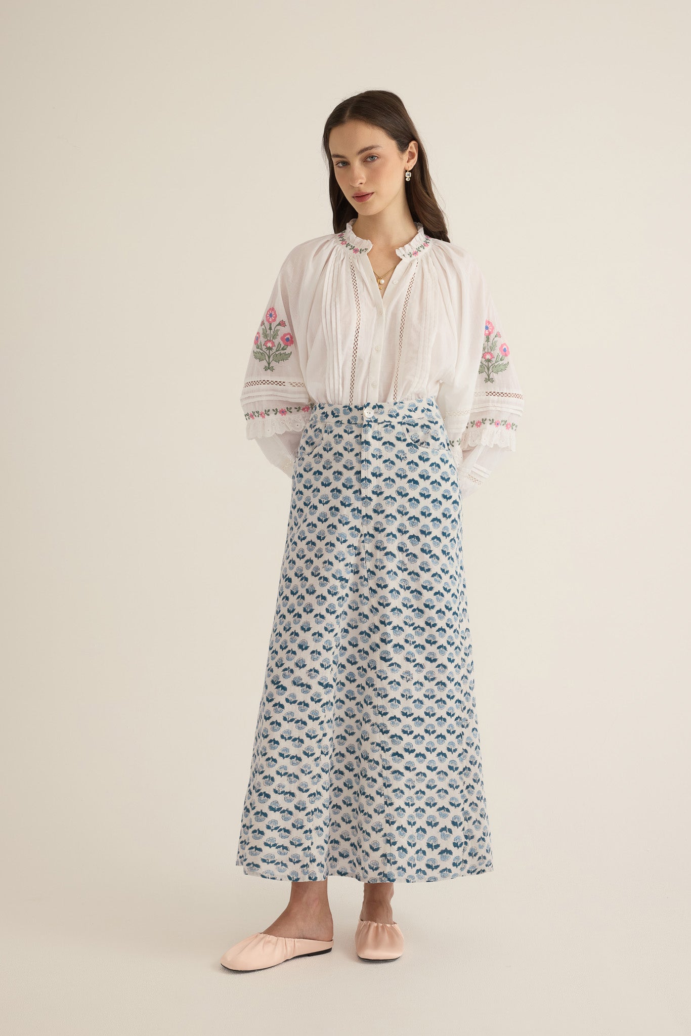 Front view of model wearing the Joni Block Printed Cotton A-Line Midi Skirt in Blue Gardenia