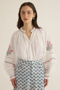 Front view of model wearing the Juliet Embroidered Cotton Juliet Drop Sleeve Raglan Shirt in Ivory with floral embroidered motifs, pintucking and lace detail