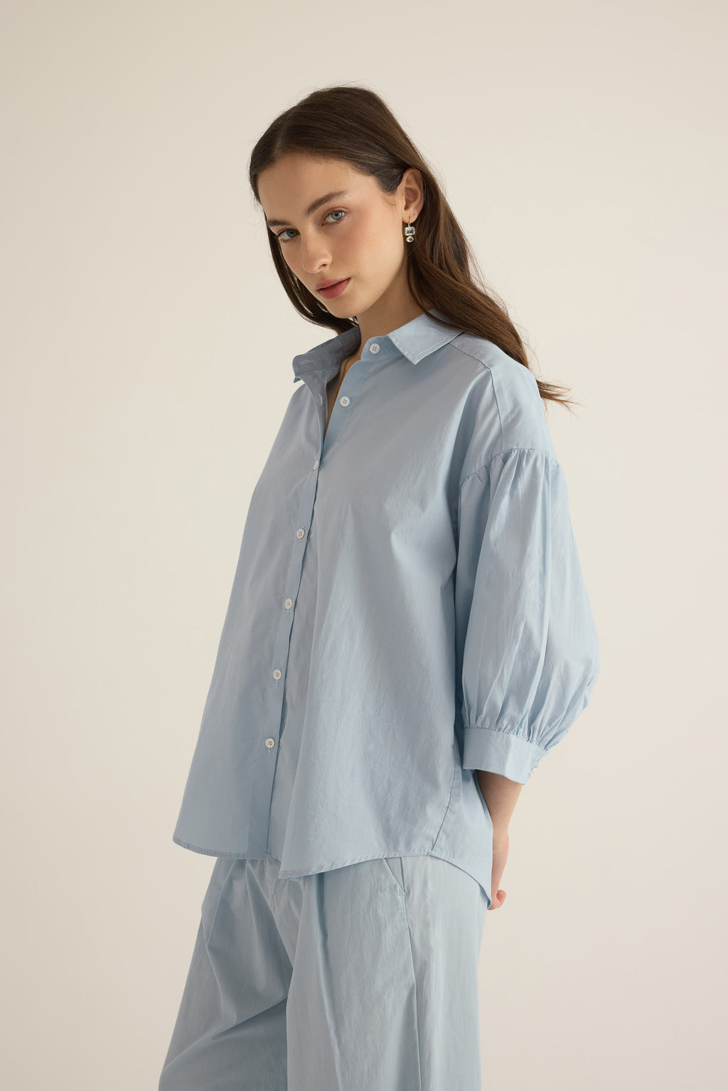 Close up of model wearing the Romeo wide cuff shirt in forget me not pale blue